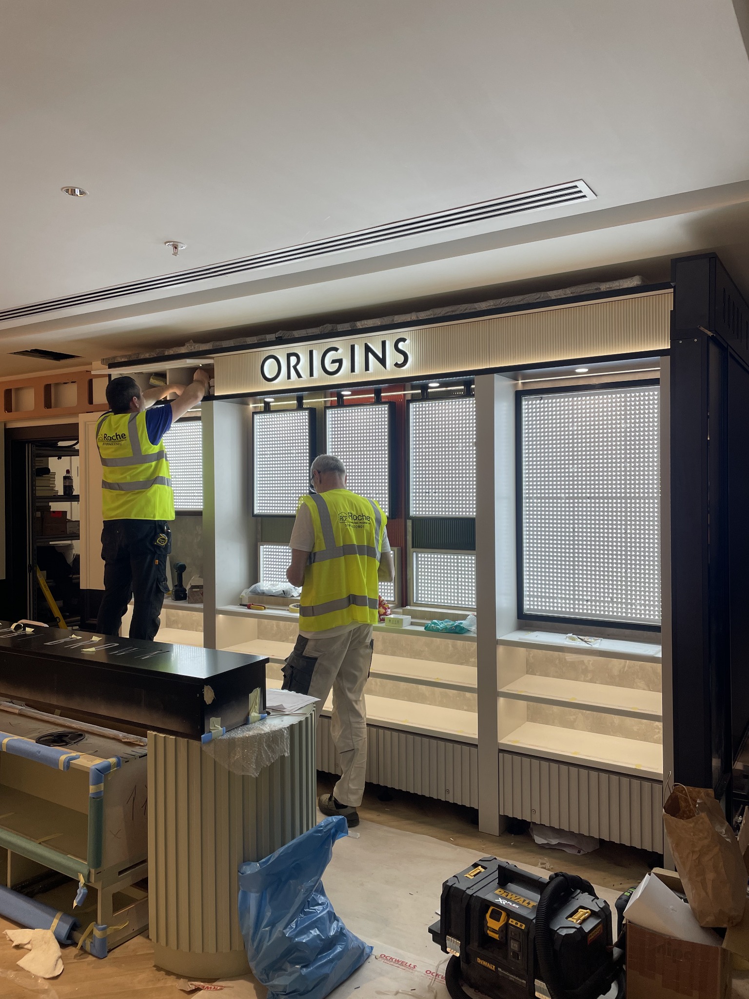 Origins retail fixture during ROCHE installation
