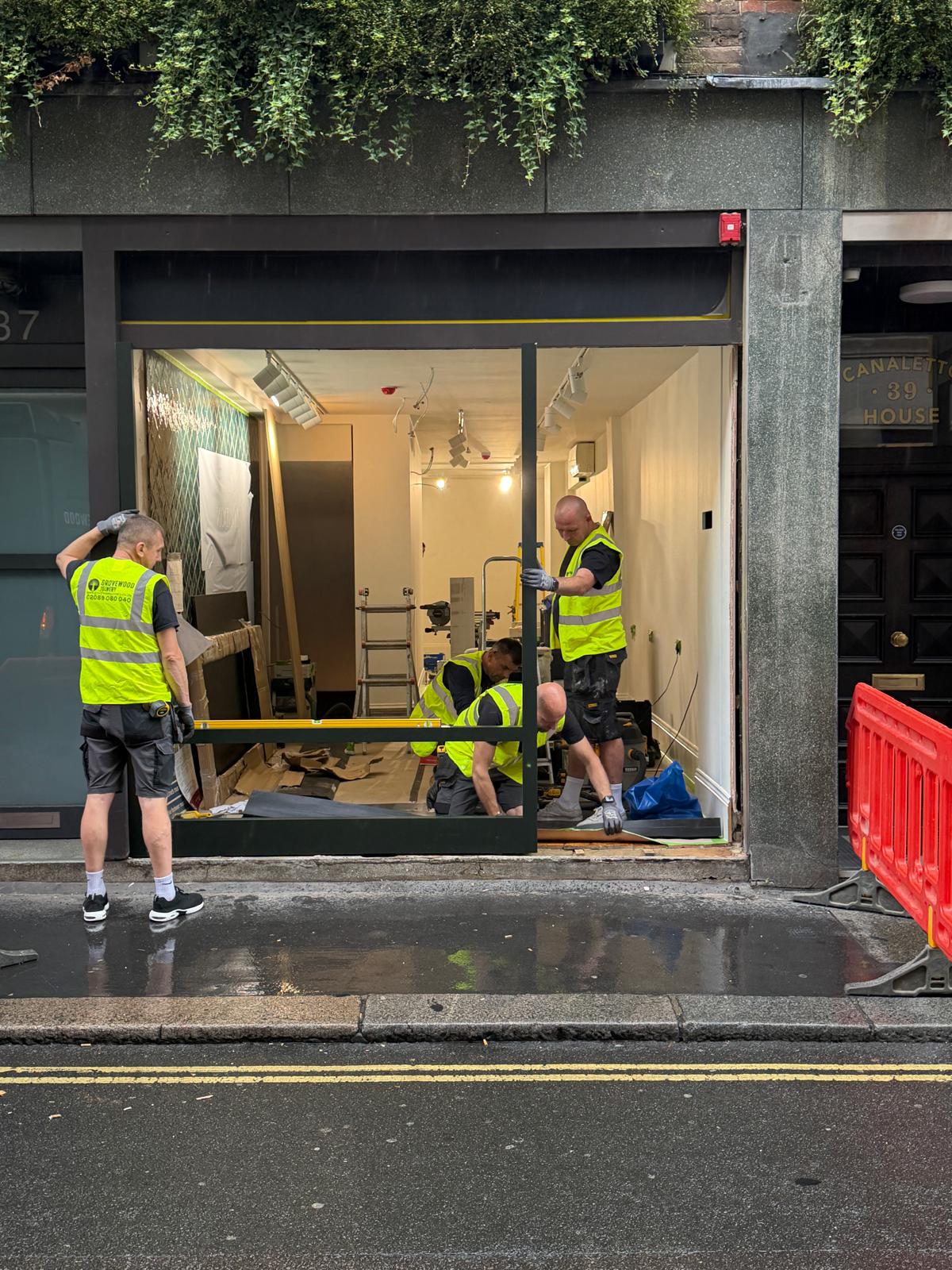 ROCHE team installing a retail storefront