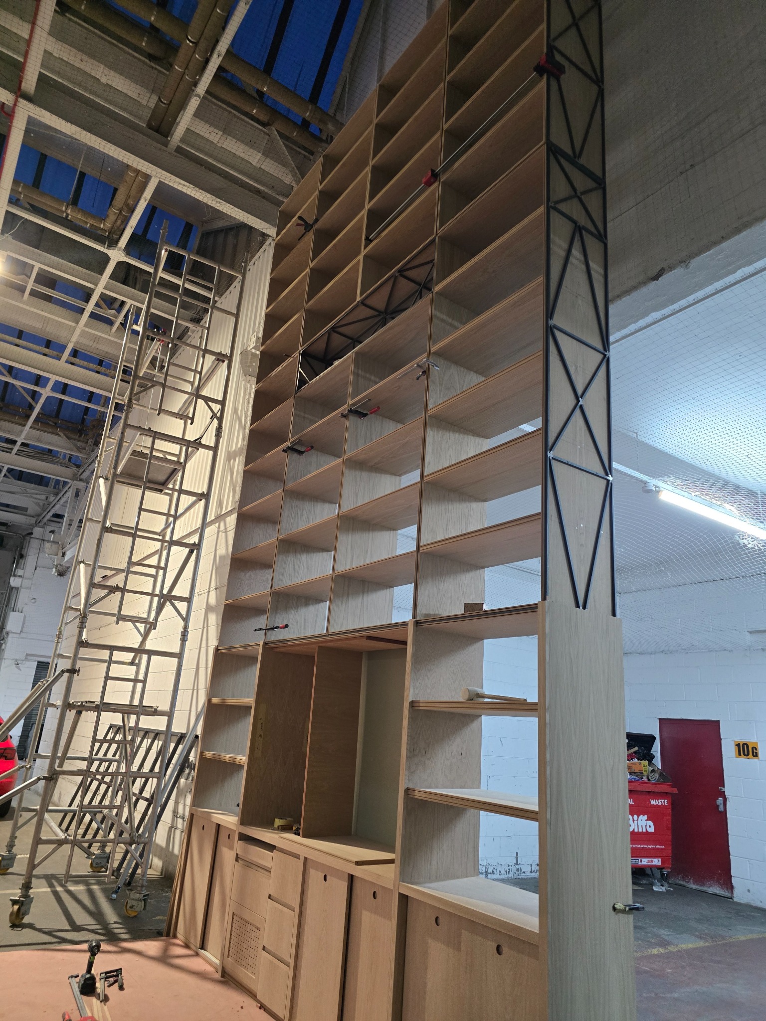 Large bespoke timber fixture during workshop fabrication